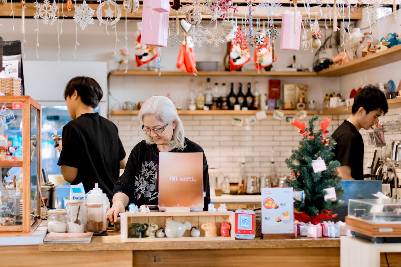 gallery-05 festive-cafe-interior-with-staff-preparing-drinks-34654339